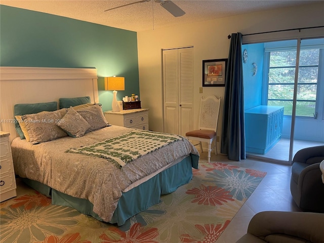 bedroom featuring a textured ceiling, a closet, and ceiling fan