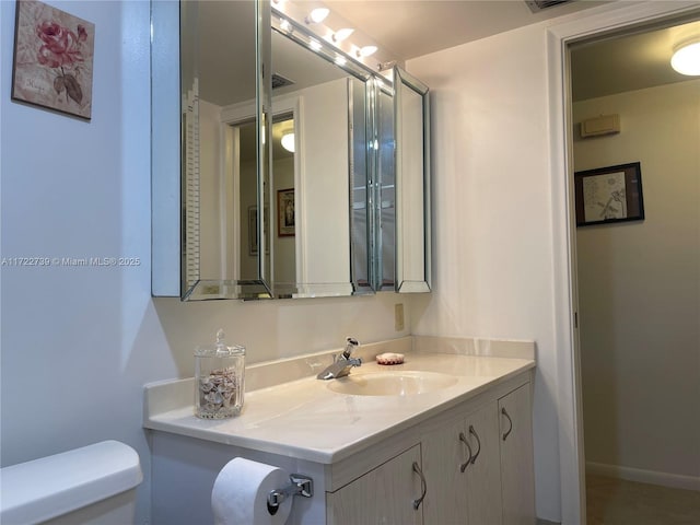 bathroom with vanity and toilet