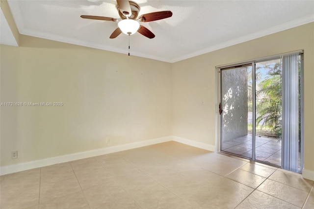 tiled spare room featuring ceiling fan and crown molding