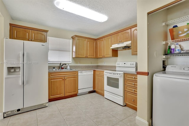 kitchen featuring sink, washer / clothes dryer, a textured ceiling, white appliances, and light tile patterned floors