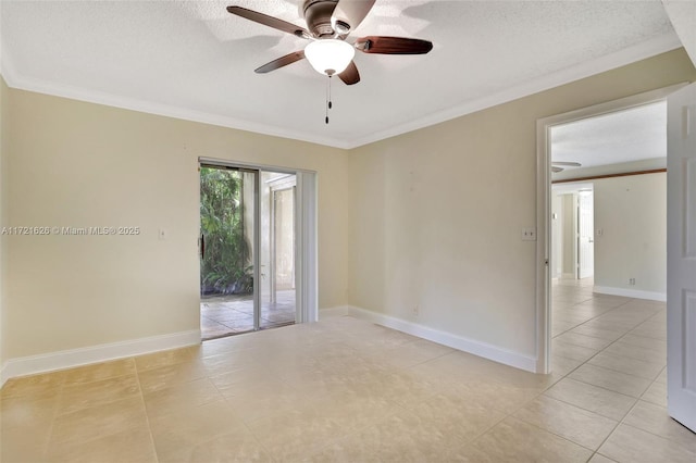 tiled empty room with ceiling fan and ornamental molding