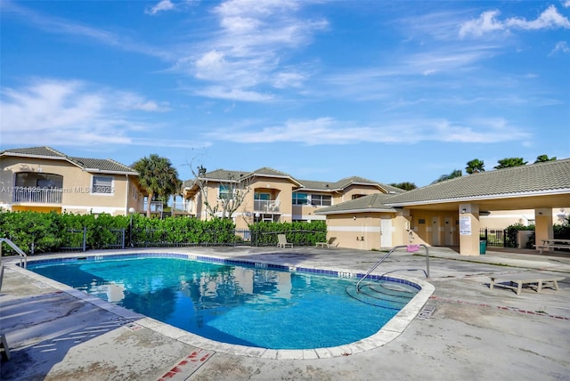 view of swimming pool with a patio