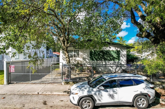 view of property hidden behind natural elements