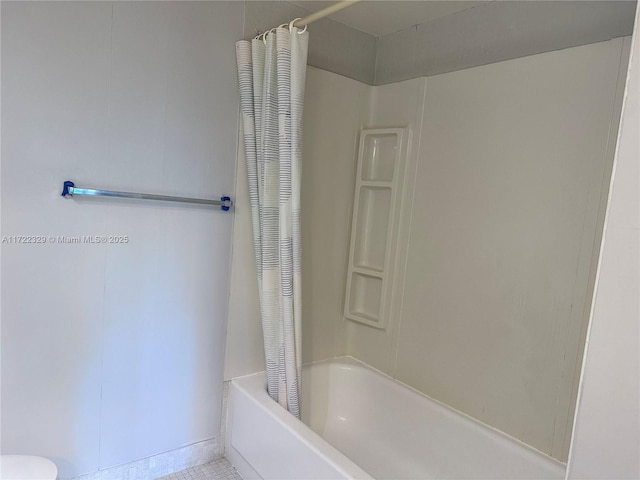 bathroom with shower / bathtub combination with curtain