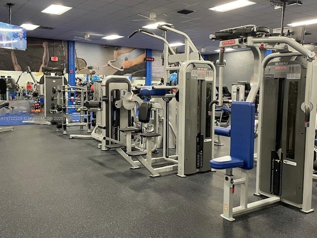 exercise room with a drop ceiling