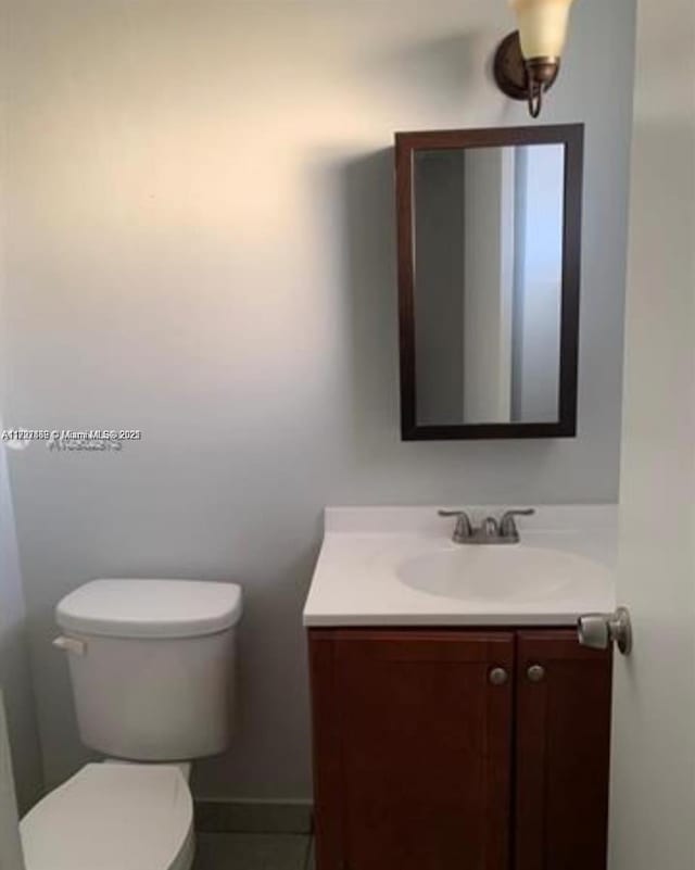 bathroom with vanity and toilet