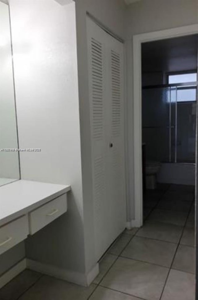 bathroom with tile patterned flooring and vanity