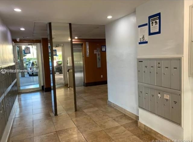 hallway featuring a mail area