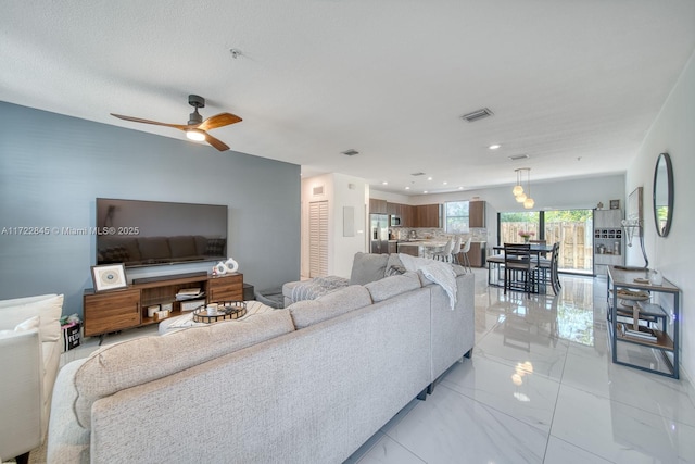 living room with ceiling fan