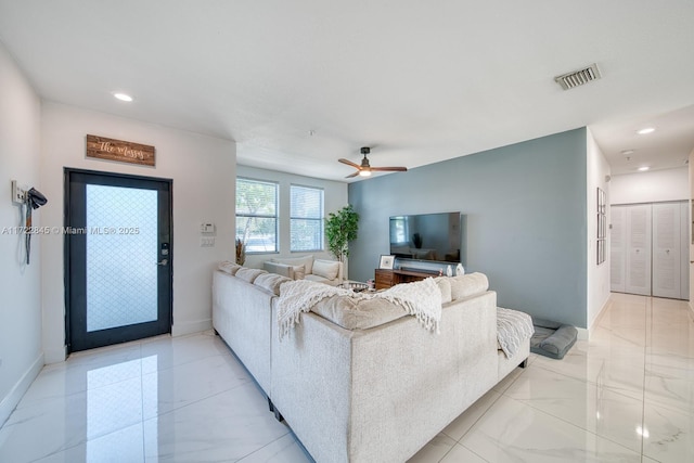 living room featuring ceiling fan