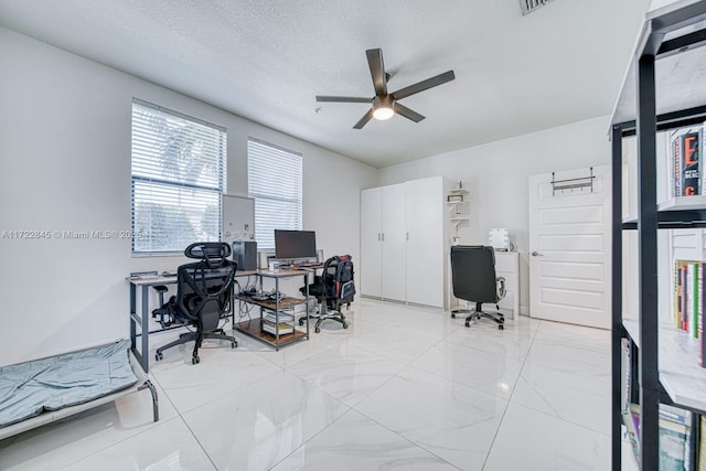 office area featuring a textured ceiling and ceiling fan