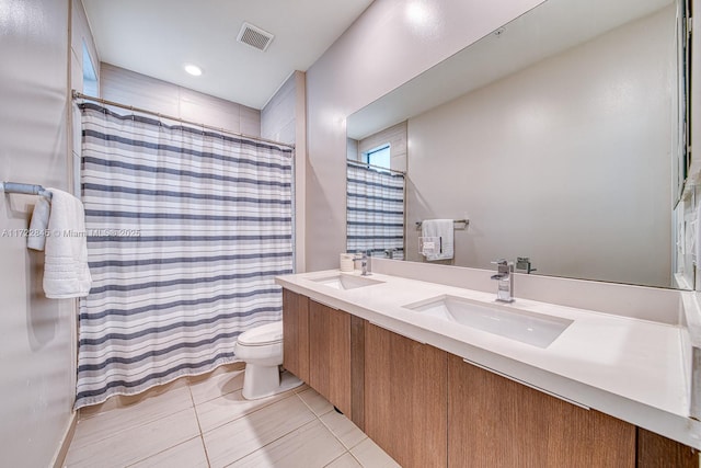 bathroom with tile patterned flooring, vanity, toilet, and a shower with shower curtain