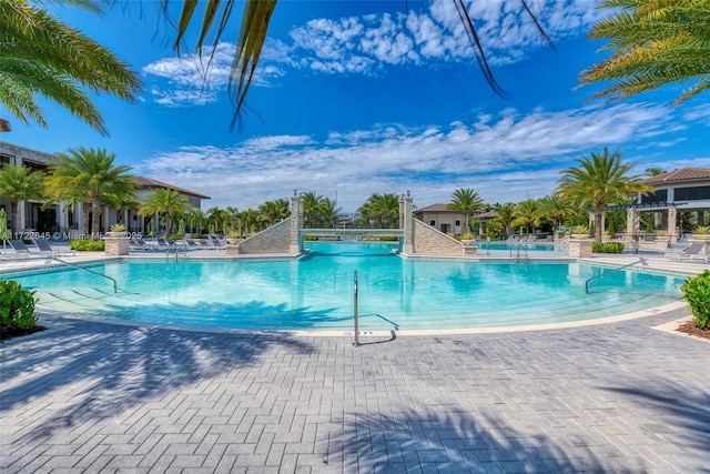 view of swimming pool featuring a patio area