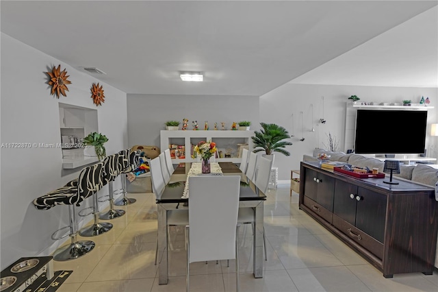 dining room with light tile patterned flooring