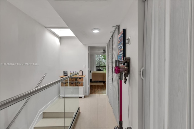 hallway featuring light tile patterned flooring