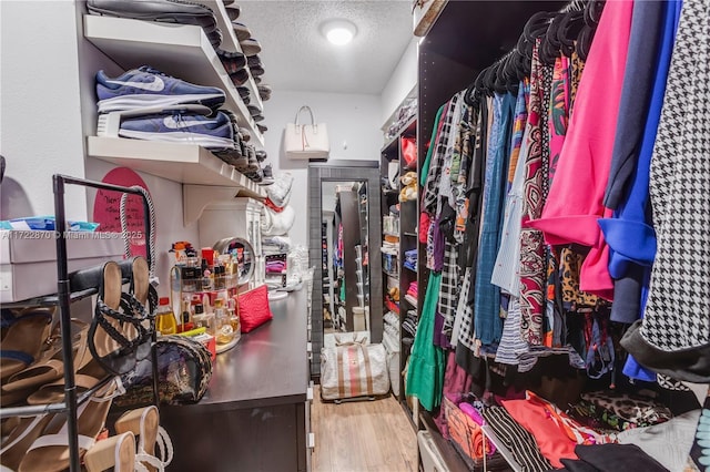 walk in closet featuring hardwood / wood-style floors