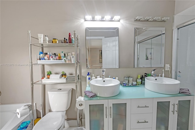 full bathroom featuring separate shower and tub, vanity, and toilet