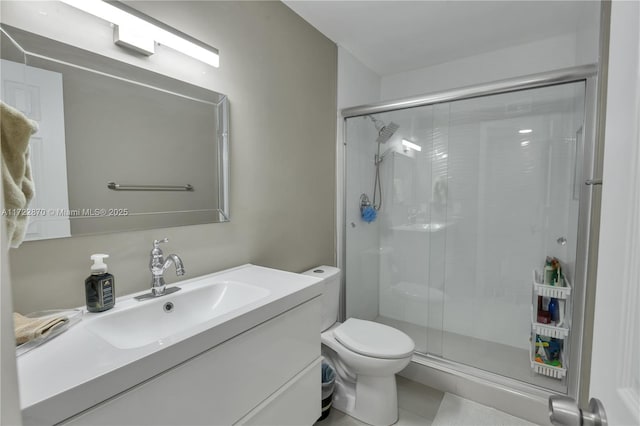 bathroom with a shower with door, vanity, and toilet