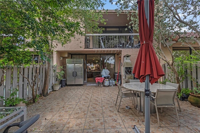 view of patio with a balcony