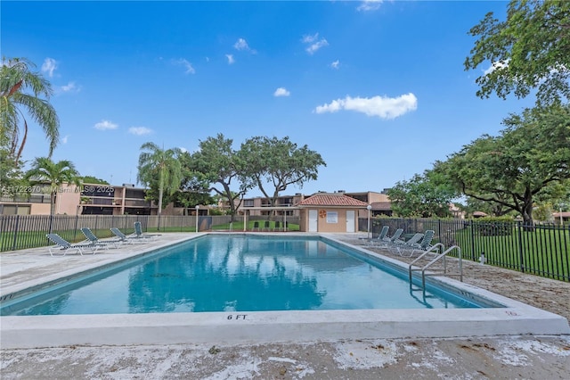 view of swimming pool with a patio