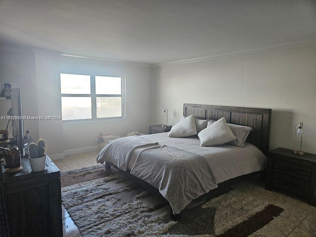 bedroom with light tile patterned floors and ornamental molding