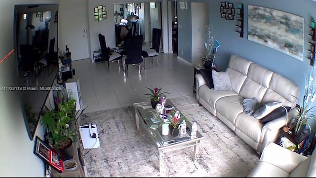 living room with tile patterned floors