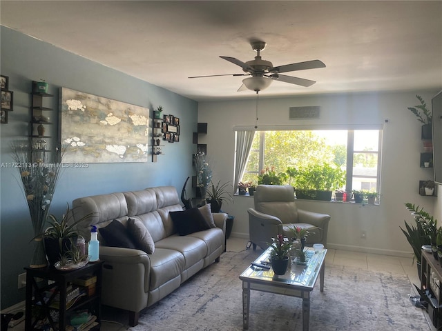 living room featuring ceiling fan and light tile patterned flooring