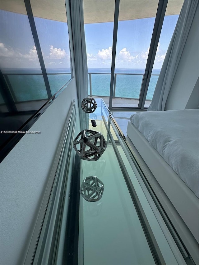 bedroom featuring a water view