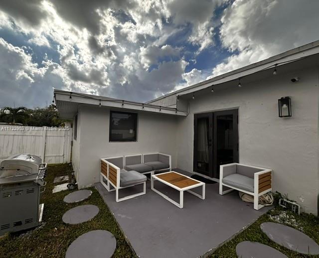 view of patio / terrace with fence and outdoor lounge area