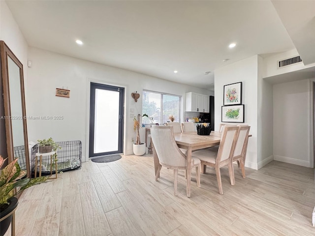 dining space with recessed lighting, visible vents, light wood-style flooring, and baseboards