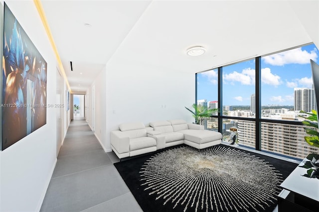 living room featuring a wall of windows