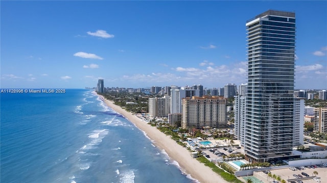 aerial view featuring a water view and a beach view