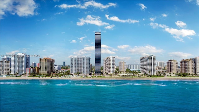 exterior space with a water view and a view of the beach