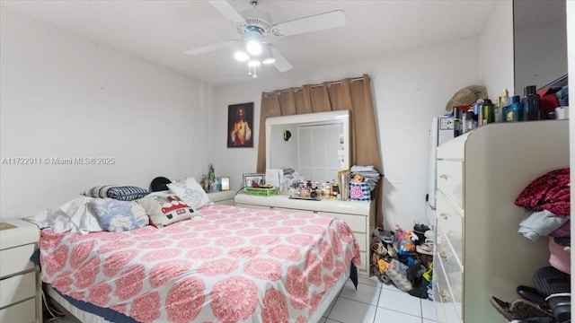 bedroom featuring ceiling fan and light tile patterned floors