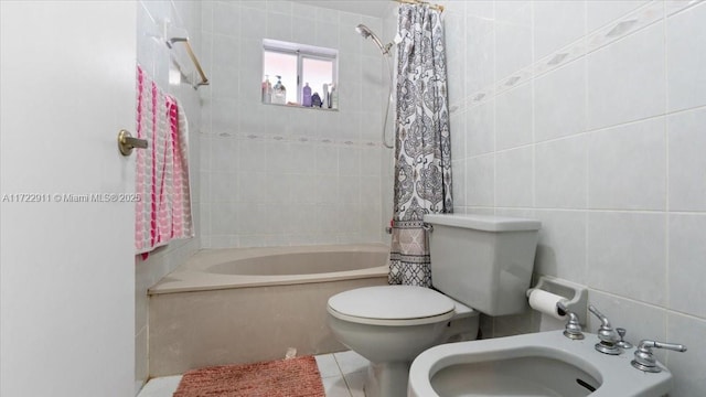 full bathroom featuring a bidet, shower / bath combination with curtain, sink, tile patterned flooring, and tile walls