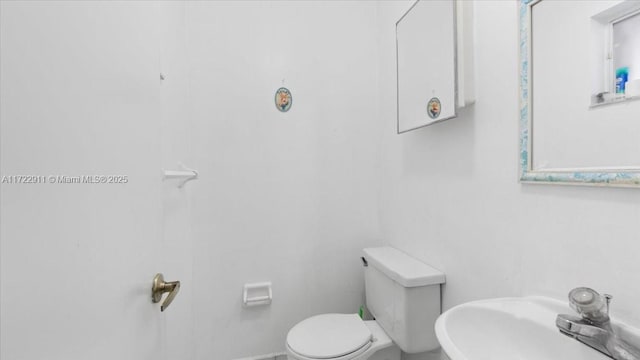 bathroom with sink and toilet