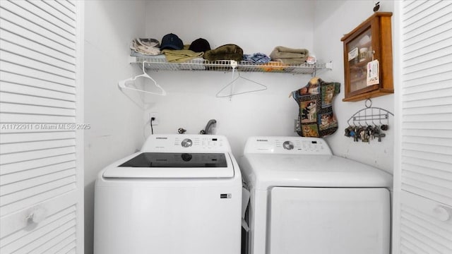 clothes washing area featuring washing machine and clothes dryer