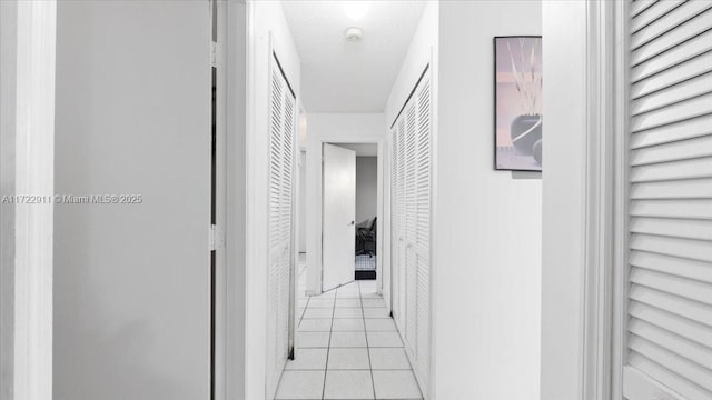 hallway with light tile patterned floors