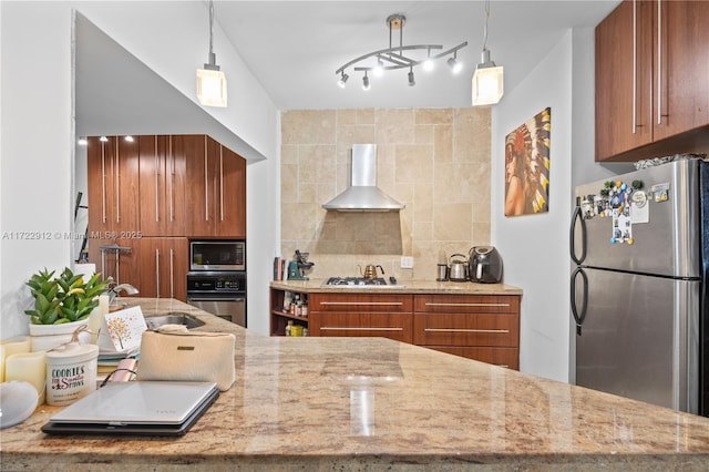 kitchen with backsplash, decorative light fixtures, wall chimney range hood, and stainless steel appliances