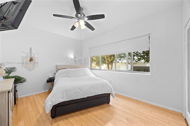 bedroom with light wood-type flooring and ceiling fan