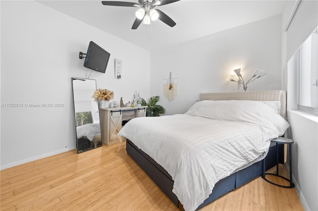 bedroom featuring light hardwood / wood-style floors and ceiling fan