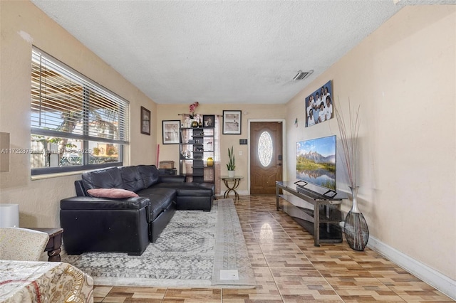 living room with a textured ceiling