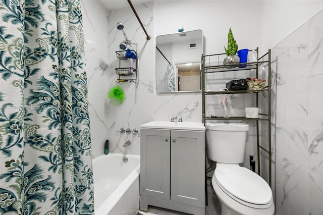 full bathroom featuring shower / tub combo, vanity, tile walls, and toilet