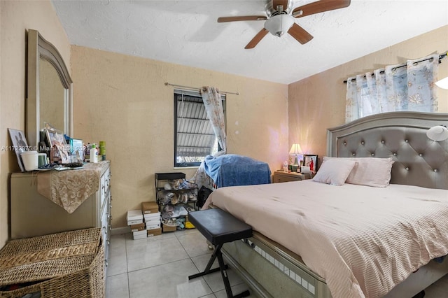 tiled bedroom with ceiling fan