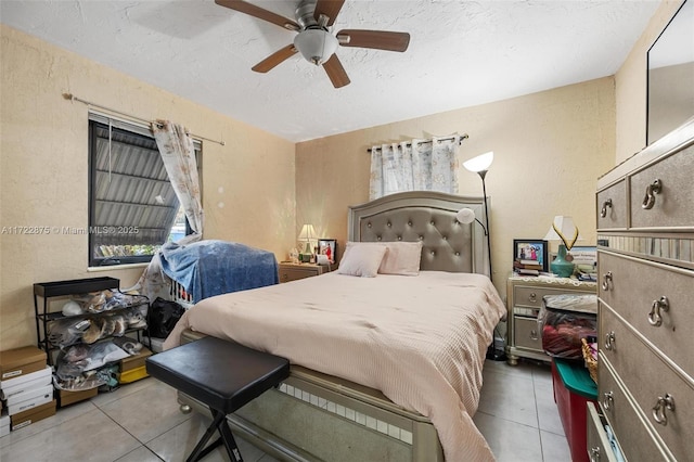 bedroom featuring ceiling fan and light tile patterned flooring