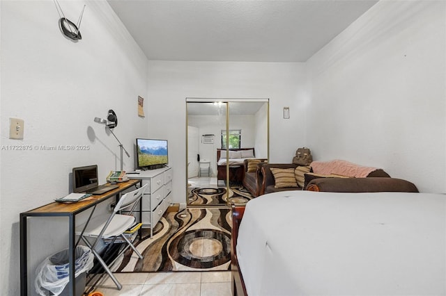 bedroom with light tile patterned floors