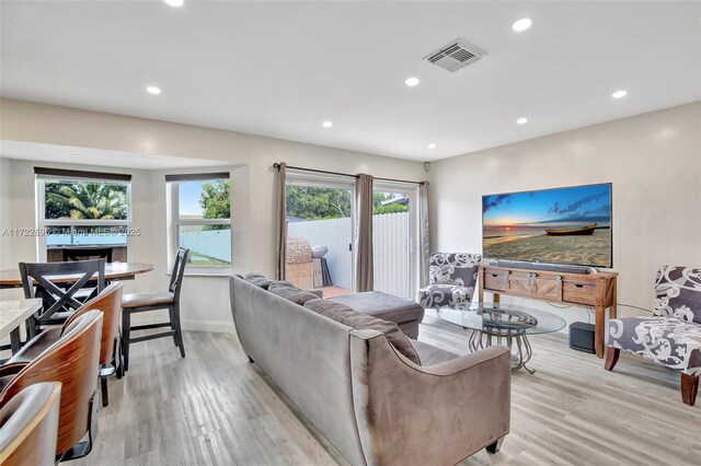 kitchen with ornate columns, sink, stainless steel appliances, a kitchen breakfast bar, and kitchen peninsula