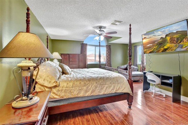 bedroom featuring hardwood / wood-style floors and ceiling fan