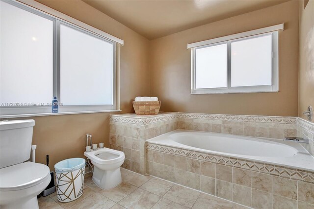 bathroom featuring tile patterned floors and independent shower and bath