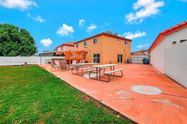 rear view of house featuring a patio and a swimming pool